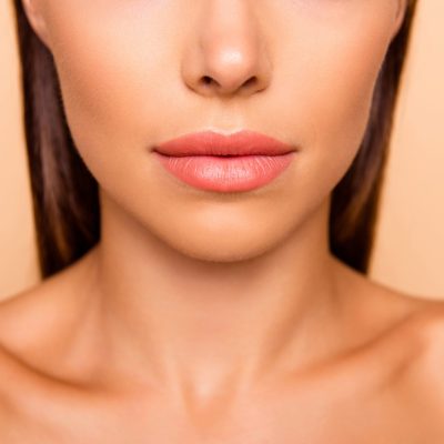 Cropped close up photo of attractive gorgeous beautiful leisure lifestyle lady with her shoulders she isolated on pastel beige background focus on lips